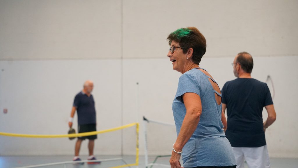 people playing sports in the sports hall