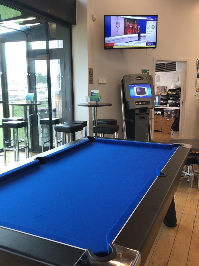 Sports bar tv, pool table and quiz machine
