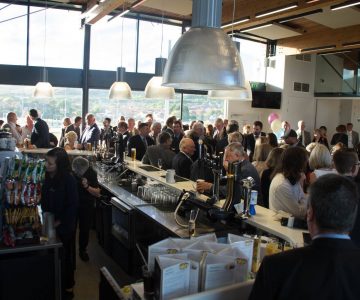 people having a drink at the bar at three hills sports park